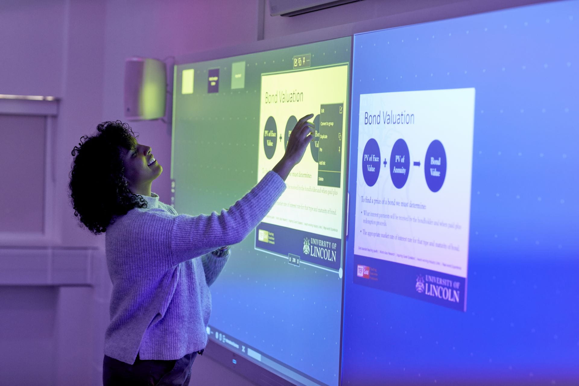 A student using the touchscreen display in the Concept Suite